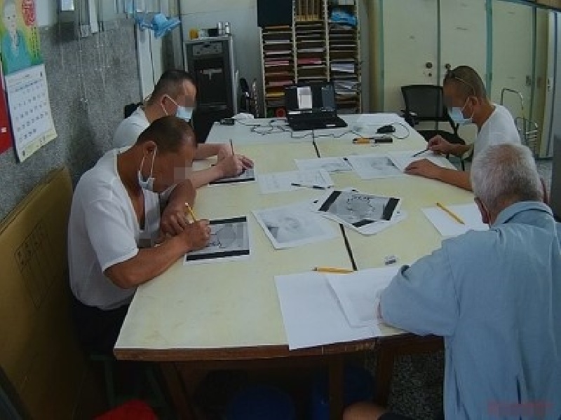 Inmates Engaged in Painting and Calligraphy Classes.